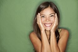 Smiling woman thinking about what to write in a gratitude letter