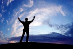Man holding hands up to sky in an attitude of gratitude