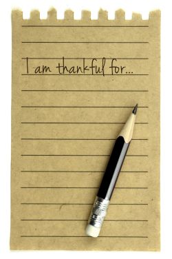 Paper and pencil for writing a gratitude list